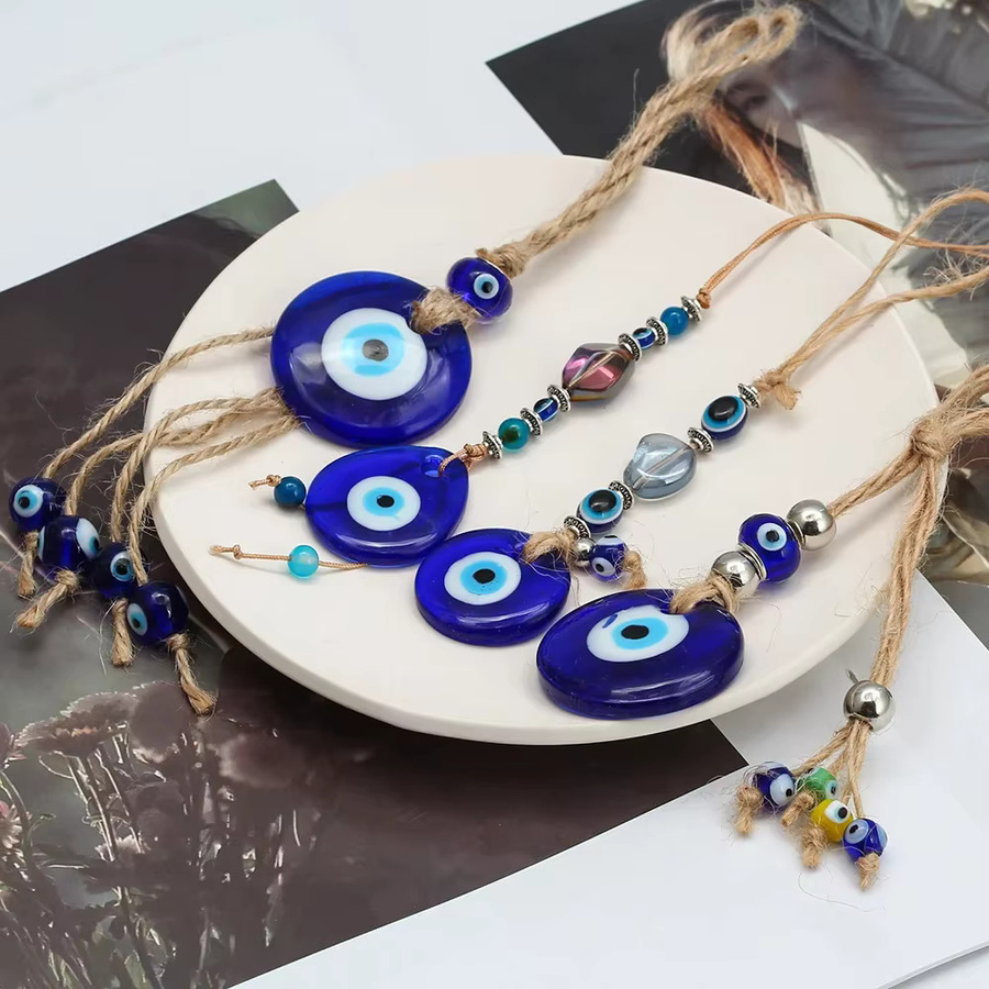 Handgefertigter Lucky Eye Wandbehang mit geflochtenem Seil und Quaste in Blau und Türkis - Bild 2
