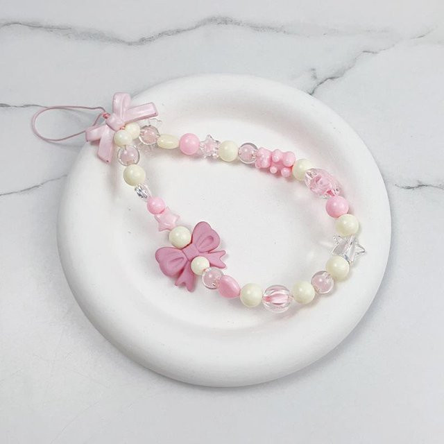 Mango Event Handy Lanyard für Damen und Mädchen mit rosa Schleife, Bär, Stern und Perlen als süßes Telefon-Charm-Zubehör in Rosa - Bild 1