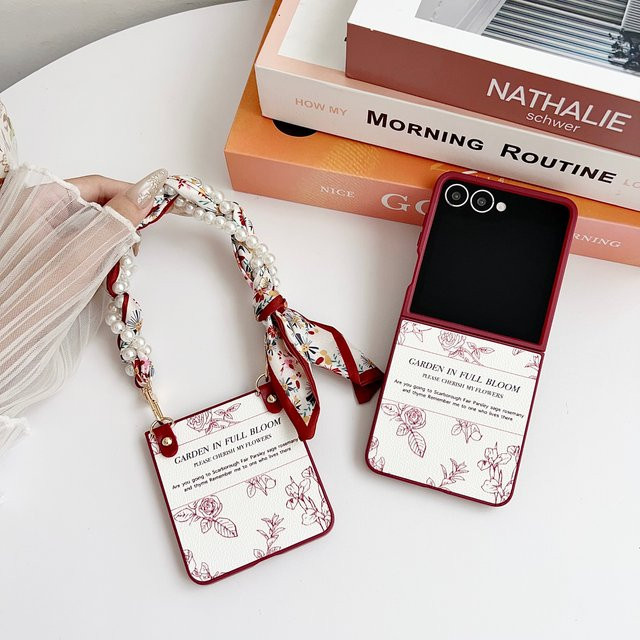 Stoßfeste Handyhülle mit Blumen-Design und Armband aus PU-Leder und hartem PC für Samsung Galaxy Z Flip 7, 6, 5, 4, 3 - Bild 1