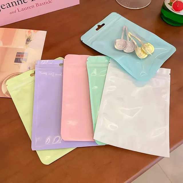 30er Set Macaron Schmucktaschen aus Kunststoff in Multicolour zur Aufbewahrung von Halsketten, Ohrringen und Ringen für unterwegs - Bild 1