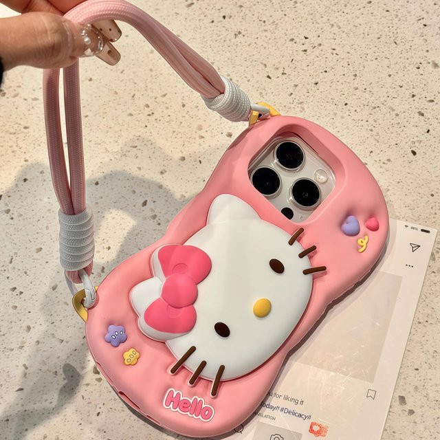 Sanrio Hello Kitty Handyhülle aus weichem Silikon mit 3D-Kopfgriff und Umhängeband für iPhone 12 bis iPhone 17 Pro Max, Farbe: Pink - Bild 1