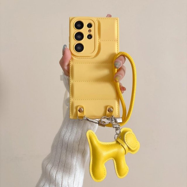 Samsung Handyhülle aus Leder mit Cartoon Hund Design und Handgelenkband in Gelb für Galaxy S26 Ultra S25 S24 Plus S23 FE S22 A17 A07 - Bild 1