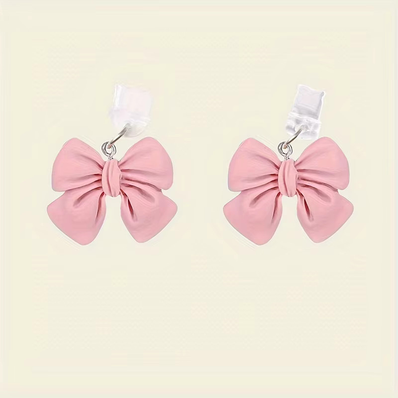 INS Stil Bowknot Staubschutzstecker für USB-C Ladeport als dekorativer Anhänger für iPhone und AirPods in Pink oder Lila - Bild 2