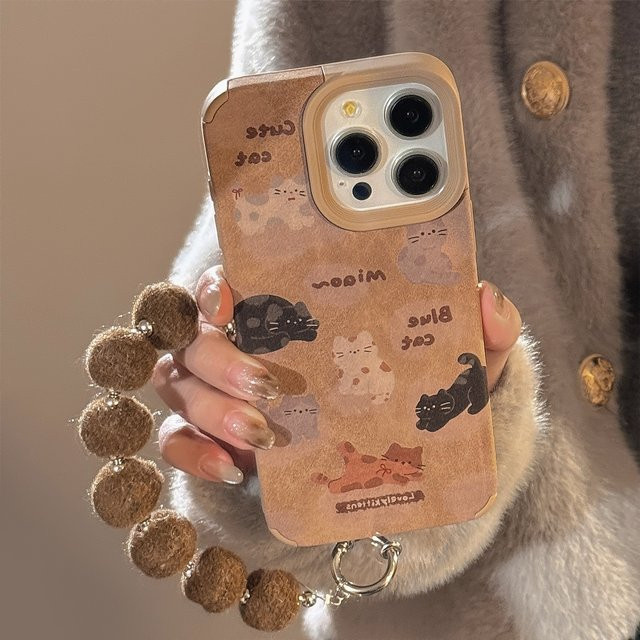 MUQGEW Handyhülle mit süßem Cartoon-Katzen-Design aus Ledertextur für iPhone 17, 16, 15, 14, 13, 12, 11 Pro Max mit stoßfester Handschlaufe in Braun - Bild 1