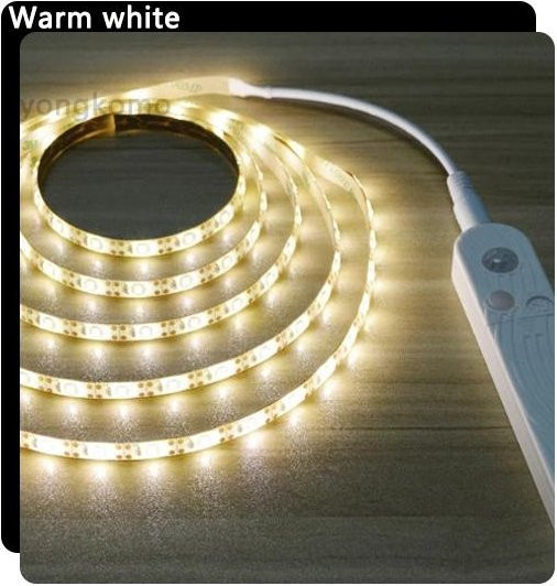Yongkomo LED-Unterschrankleuchte mit kabellosem PIR-Bewegungssensor, warmweißes Licht, 4m LED-Streifenlampe in Weiß - Bild 1