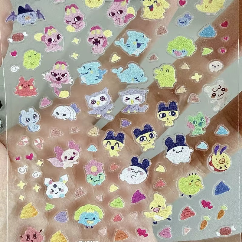Tamagotchi Mametchi und Kuchipatchi Nagelaufkleber, bunte Cartoon-Sticker für DIY-Dekorationen an Notizbüchern und Handyhüllen - Bild 2