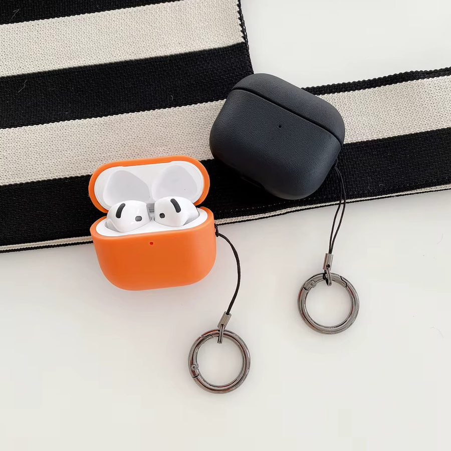Stoßfeste Kopfhörerhülle für Apple AirPods 1, 2, 3, 4 und Pro 2 mit simuliertem Ledermuster und Haken in Schwarz - Bild 2