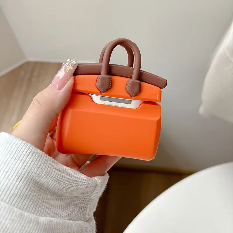 Sanrio Silikon-Handtaschen-Etui mit Anhänger für Apple AirPods Pro 1. und 2. Generation, Farbe: Orange - Bild 2