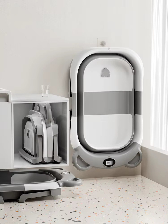 Tragbare zusammenklappbare Babybadewanne in Grau mit Thermometer, weichem schwimmendem Kissen und Abflussloch für Babys von 0–36 Monaten - Bild 2