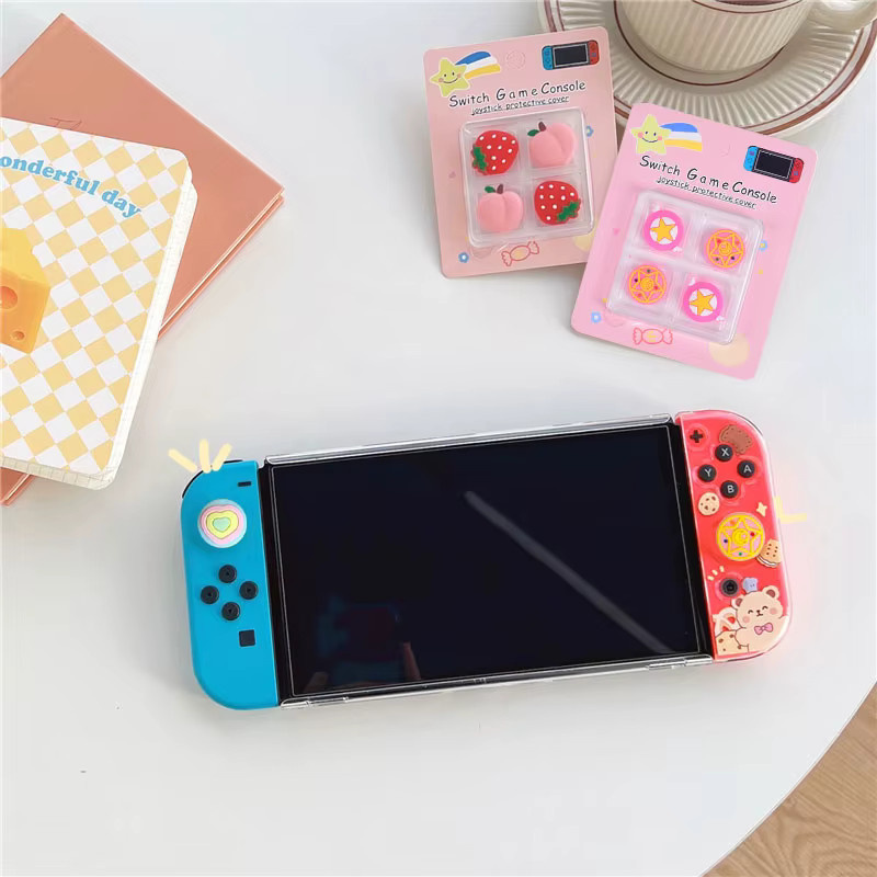 4 Stück Cartoon Daumengriffkappen aus weichem Silikon für Nintendo Switch OLED, Lite und Joy-Con Controller in Multicolor - Bild 1