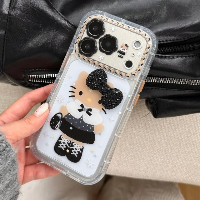 Sanrio Hello Kitty Handyhülle mit 3D Glitter Bogen Design in Schwarz für iPhone 13 bis iPhone 17 Pro Max inklusive Objektivschutz - Bild 1