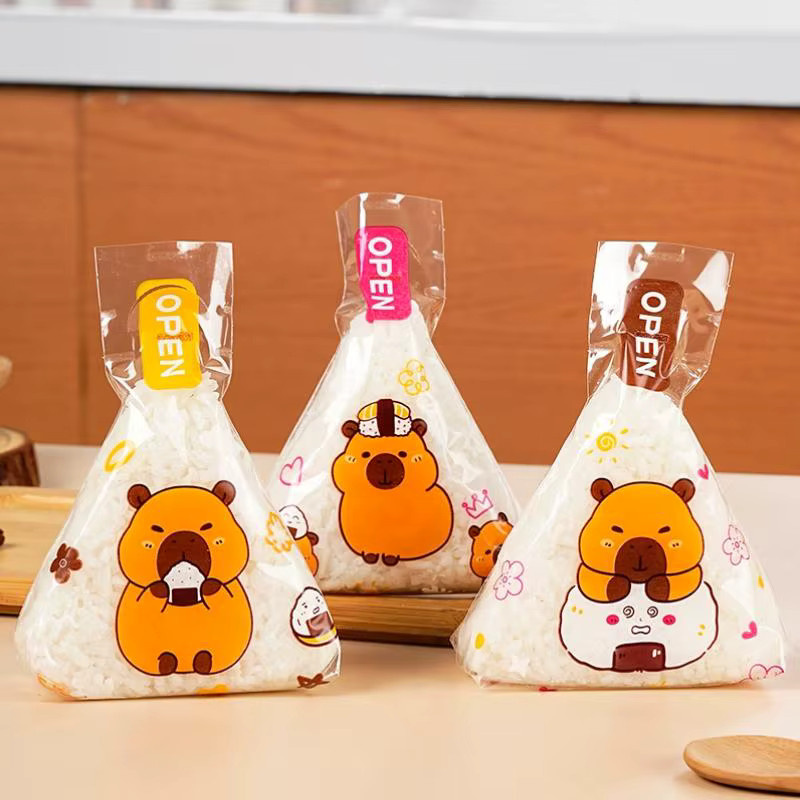 50 oder 100 Stück transparente Dreieck Onigiri Sushi Taschen mit Cartoon Capybara Motiv aus Kunststoff für Bento und Reisbälle - Bild 5