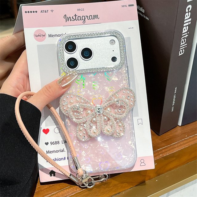 MUQGEW Luxuriöse iPhone Handyhülle mit Laser-Herz-Shell-Muster und vergoldetem Diamant-Schmetterlings-Design in Gold, stoßfeste Schutzhülle für iPhone 17, 16, 15, 14, 13 Pro Max - Bild 1