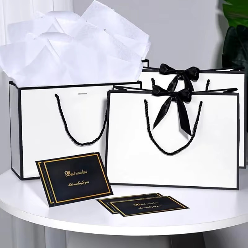 Elegantes Geschenktüten-Sortiment aus weißem Papier mit schwarzen Bandgriffen für Hochzeiten und Partys - Bild 4