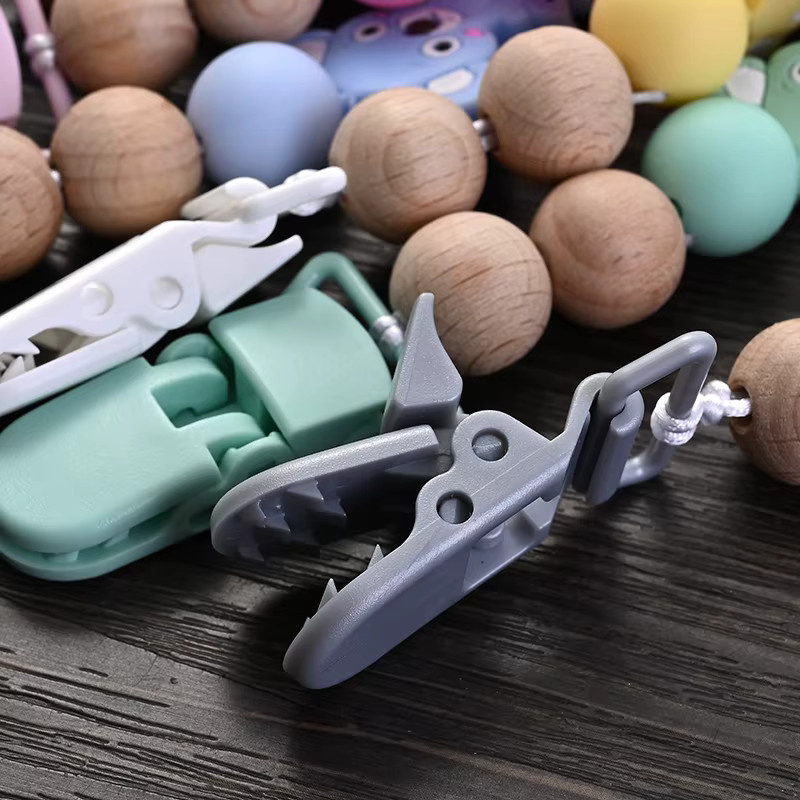 Baby Schnullerhalter Kette mit Tier-Motiven aus Silikon und Kunststoff in Gelb und Bunt - Bild 3