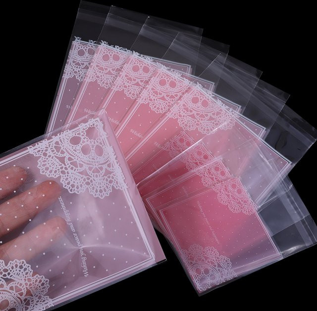 100 Stück rosa OPP-Geschenkverpackungsbeutel mit Selbstverschluss und Spitzenblumen-Aufdruck - Bild 1
