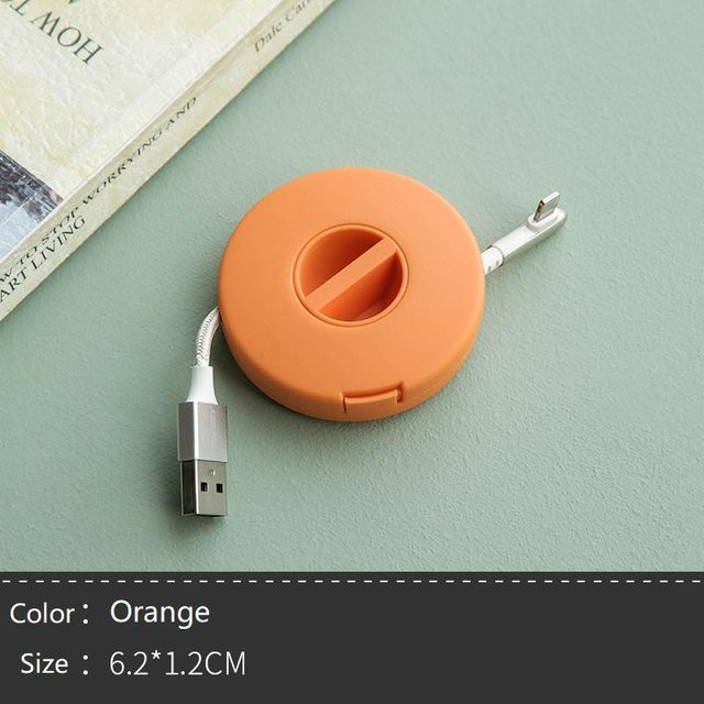 Drehbarer runder Kopfhöreraufwickler und USB-C Kabelhalter zur Aufbewahrung von Ladekabeln in Orange - Bild 1