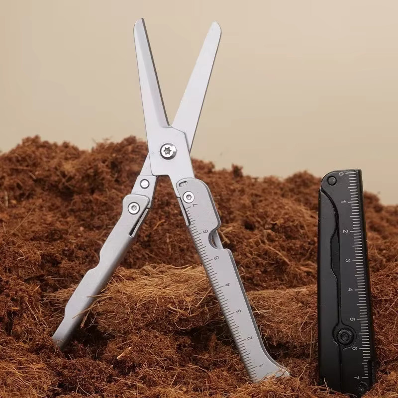 Multifunktionale Mini-Edelstahlschere faltbar und tragbar in Silber für Outdoor und Camping - Bild 1