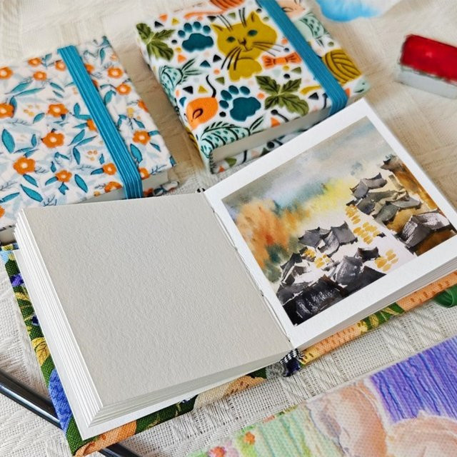 Tragbares Stoff-Mini-Aquarellbuch mit Hardcover und hochwertigem Aquarellpapier aus Baumwolle und Holzfaser in Mehrfarben - Bild 1