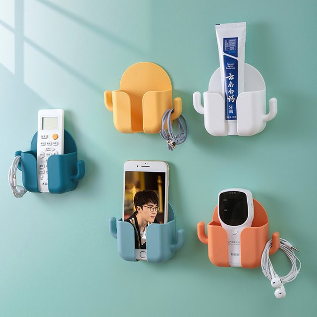Multifunktionale Wand-Aufbewahrungsbox in Orange mit Ladehalterung und Haken zur stanzfreien Montage für Fernbedienungen und Smartphones - Bild 1