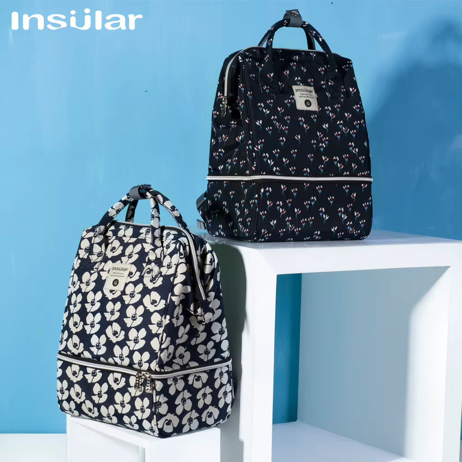 Grauer Umstandsrucksack mit großem Fassungsvermögen, mehreren Fächern und Kinderwagenhaken als Baby-Wickeltasche und Stillbeutel - Bild 1