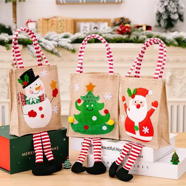 Weihnachtliche Geschenktasche mit Santa Claus und Schneemann Motiv in Mehrfarbig - Bild 1
