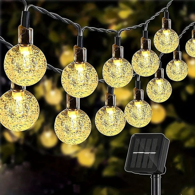 IEEYEEY Solar-Lichterkette mit 100 warmweißen LEDs und transparenten Kristallkugeln aus Glas für den Außenbereich - Bild 1