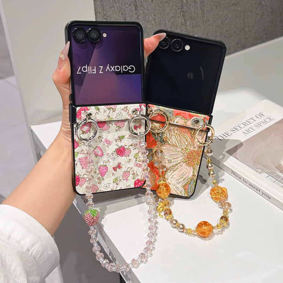 Samsung Galaxy Z Flip Handyhülle aus PU-Leder mit Scharnierschutz und farbiger Perlen-Handgelenkskette in Orange und Multicolour - Bild 1