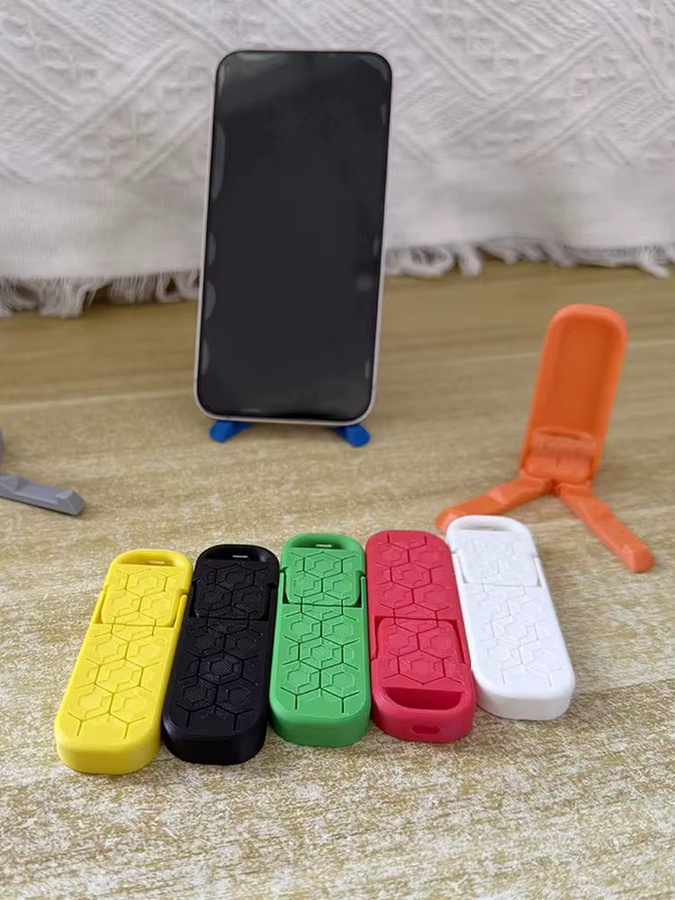 Tragbarer faltbarer Handyständer im 3D-Druck Design für universelle Mobiltelefone in Gelb - Bild 3