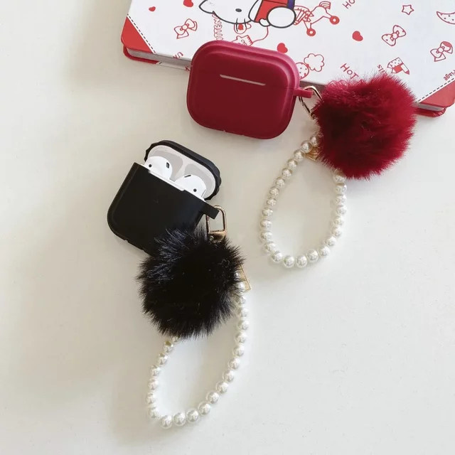 Silikon Schutzhülle für Apple AirPods Pro 1, 2 und 3 mit flauschiger Pom-Pom-Perlenkette in Schwarz - Bild 1