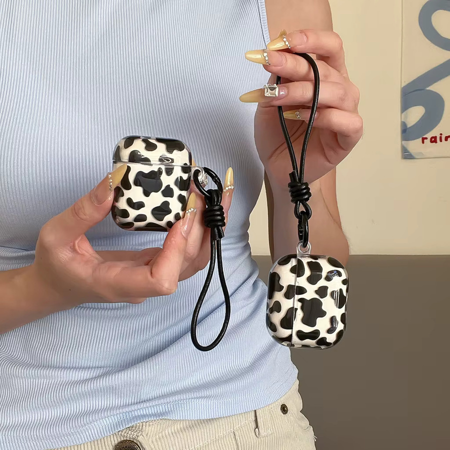 Leder-Lanyard Kopfhörerhülle mit Kuhmuster für Apple AirPods 1, 2, 3, 4 und Pro in Schwarz-Weiß - Bild 2