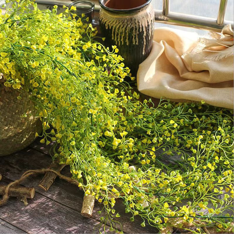 Künstliche Rattan-Reben als hängender Wandbehang mit grünen Blättern und Blumen in Bohemian-Stil - Bild 2