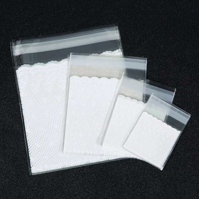 100 Stück selbstklebende OPP-Geschenktüten mit weißem Spitzenbesatz, wiederverschließbare Kunststoffbeutel für Hochzeiten, Geburtstage und Partys, transparent/weiß - Bild 1