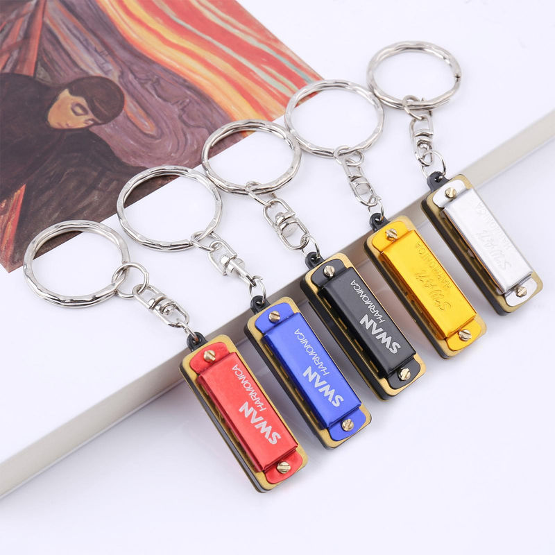 SWAN Mini-Harmonika Schlüsselanhänger in Gold mit 4 Löchern und 8 Tönen als dekoratives Musik-Accessoire aus Metall und Kunstharz - Bild 3