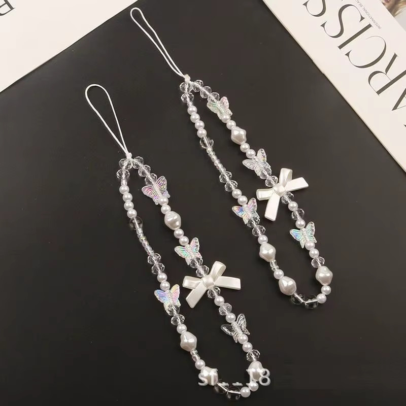 Handykette mit weißen Kunstperlen und Schleifen, Unisex - Bild 2