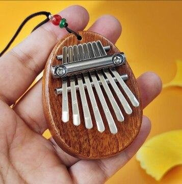 Rui Di Holz Mini Daumenklavier Musikspielzeug, 8 Töne, ab 0 Jahren - Bild 1