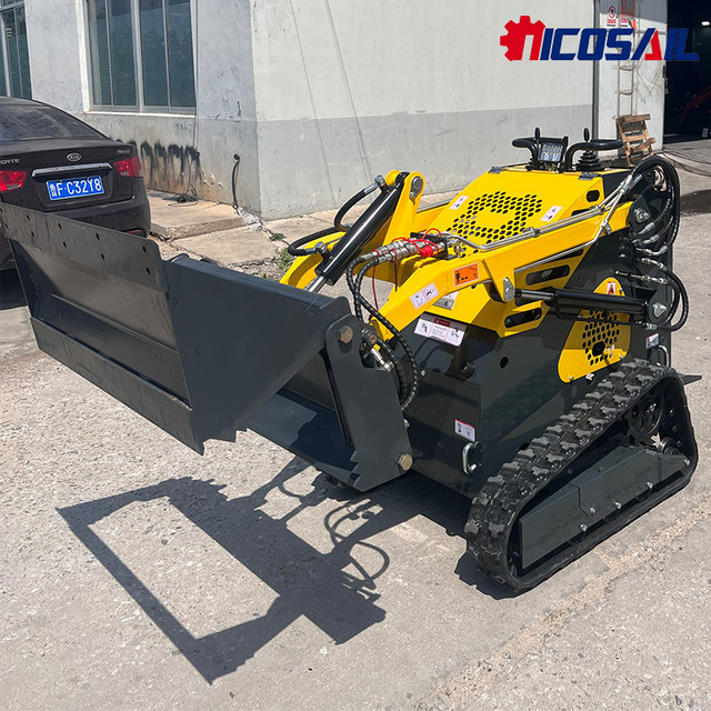 Kubota Mini Skidsteer Loader Kompaktlader mit Diesel Raupenantrieb in Gelb - Bild 1