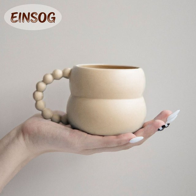 Keramik-Kaffeetasse aus Porzellan mit Kugelgriff in Beige mit mattierter Oberfläche und glasiertem Innenraum - Bild 1