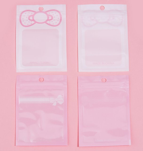 20er Set rosa selbstklebende Geschenktaschen mit Schleifen für Schmuck und Süßigkeiten aus Kunststoff - Bild 1