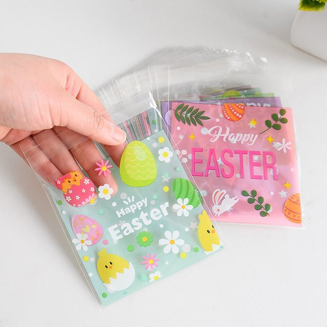 100 Stück ZQNYCY Ostern Geschenkverpackung Taschen aus Kunststoff mit Häschen und Eiern in Mehrfarbig für Süßigkeiten und Kekse - Bild 1