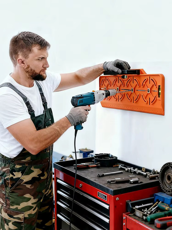 Bohrschablone mit Wasserwaage und Lineal zur Montage von Steckdosen in Orange - Bild 6