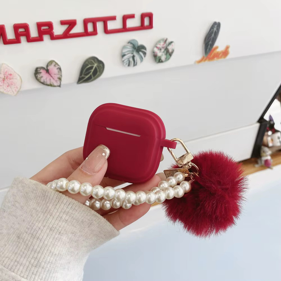 Silikon Schutzhülle für Apple AirPods Pro 1, 2 und 3 mit flauschiger Pom-Pom-Perlenkette in Schwarz - Bild 2