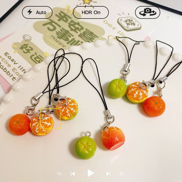 Kreatives Telefon-Lanyard in Orange mit Obst-Design als Anhänger für dein Handy oder Kopfhörer-Etui - Bild 1