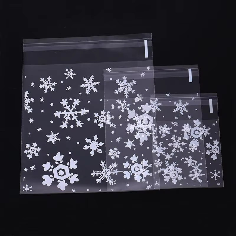 100 Stück Selbstklebende Schneeflocken Geschenkbeutel aus transparentem Kunststoff für Süßigkeiten, Kekse und Snacks zur Dekoration von Hochzeiten, Geburtstagen oder Weihnachtsfeiern - Bild 2