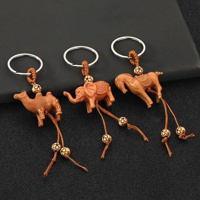 Noter Schlüsselanhänger, 3D-Tiere, Elefant, Kamel, Harz, Holzimitation, Unisex - Bild 1