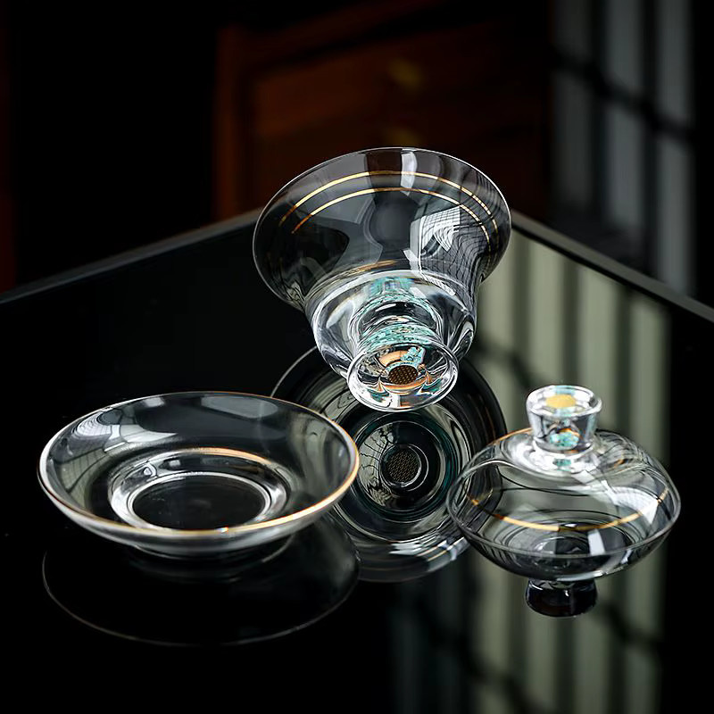 Luxuriöses Teeschalen-Set aus transparentem Glas in Türkis mit goldbemaltem Deckel und Drei-Talente-Motiv - Bild 2