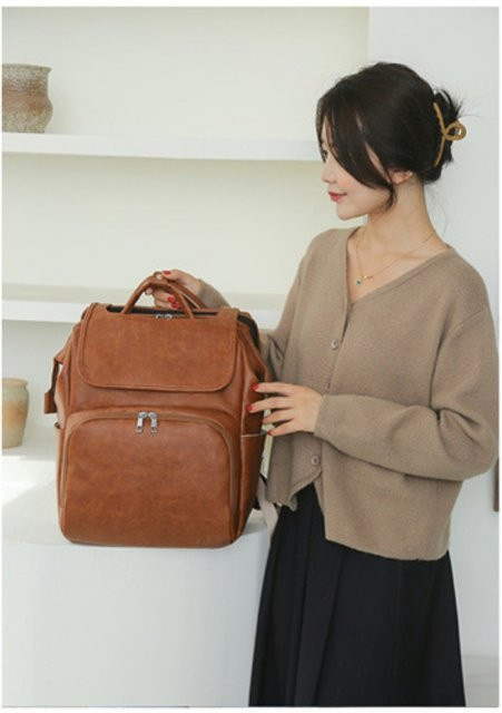 Wasserdichter Wickelrucksack für Eltern als Multifunktions-Reise- und Outdoor-Tasche in Beige und Braun - Bild 1