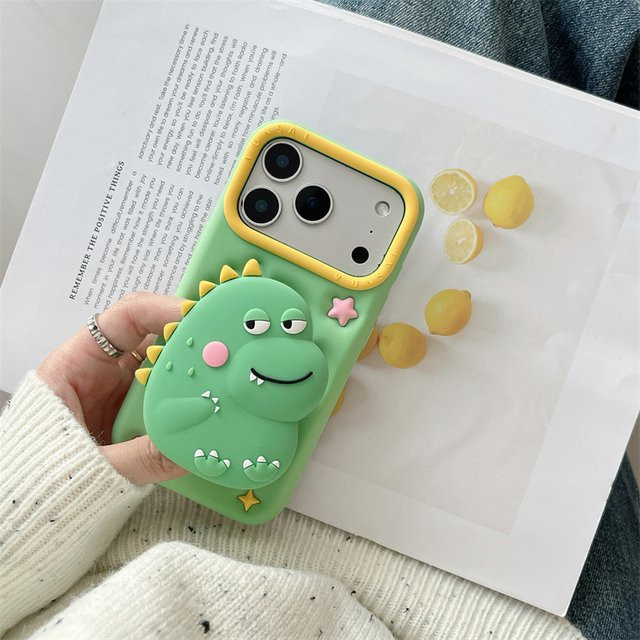 MUQGEW Silikon Schutzhülle mit 3D Cartoon Dinosaurier Teleskop Halterung für iPhone 17 16e 15 14 13 Pro Max in Grün - Bild 1