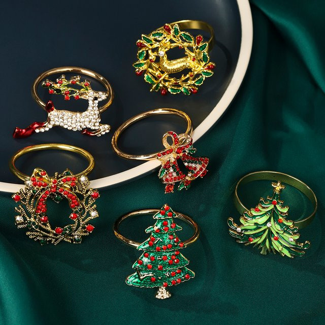 6er Set Goldene Weihnachts Serviettenringe aus Metall mit Schneeflocken, Pflaumen, Hirschen und Weihnachtsbäumen zur Tischdekoration - Bild 1