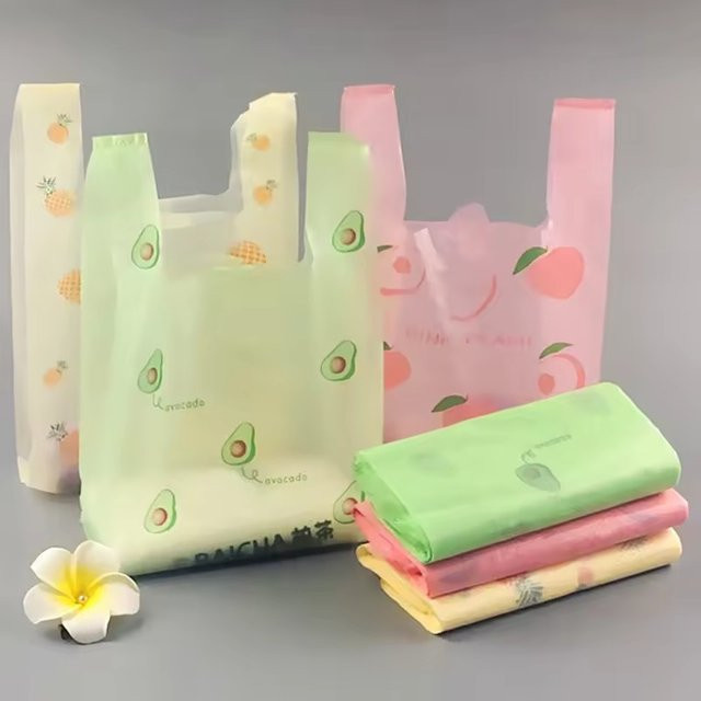 Bunte Plastiktüten mit Griffen und Fruchtmuster in Mehrfarbig für Küche, Einkauf und Geschenkverpackung - Bild 1